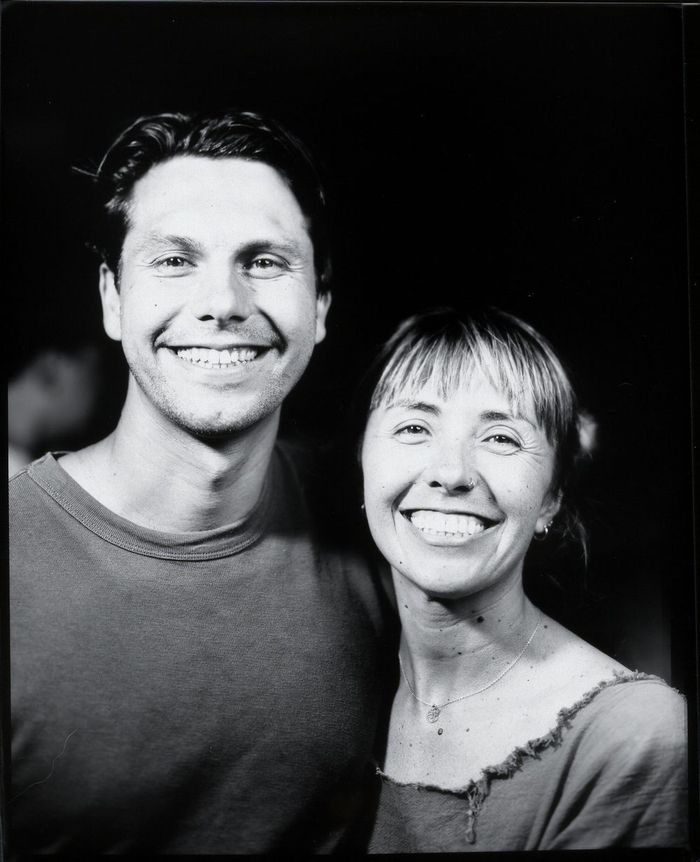 Black-and-white large format portrait of a smiling couple