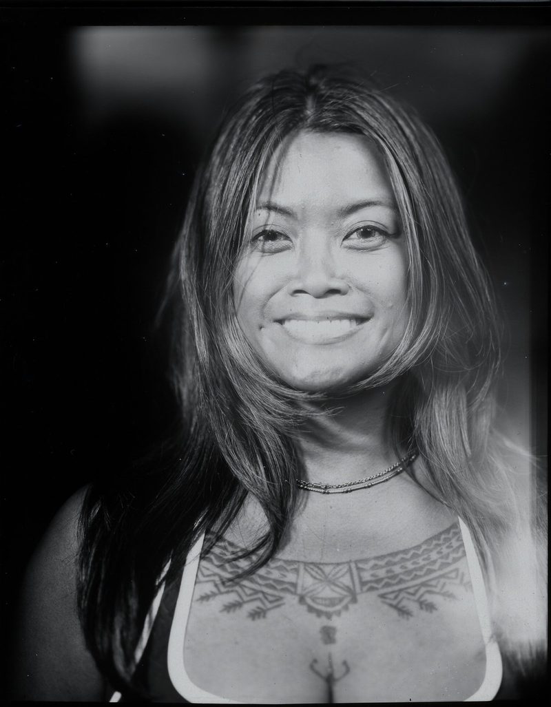 Black-and-white portrait of a smiling woman, made at Seattle Outdoor Dance